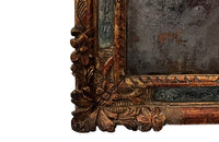 Beautiful early 18th Century French carved gilt wood cushion mirror with foxed glass
