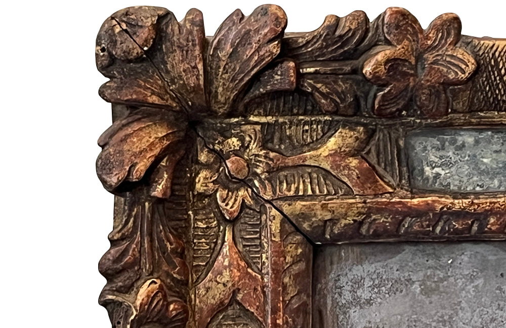 Beautiful early 18th Century French carved gilt wood cushion mirror with foxed glass