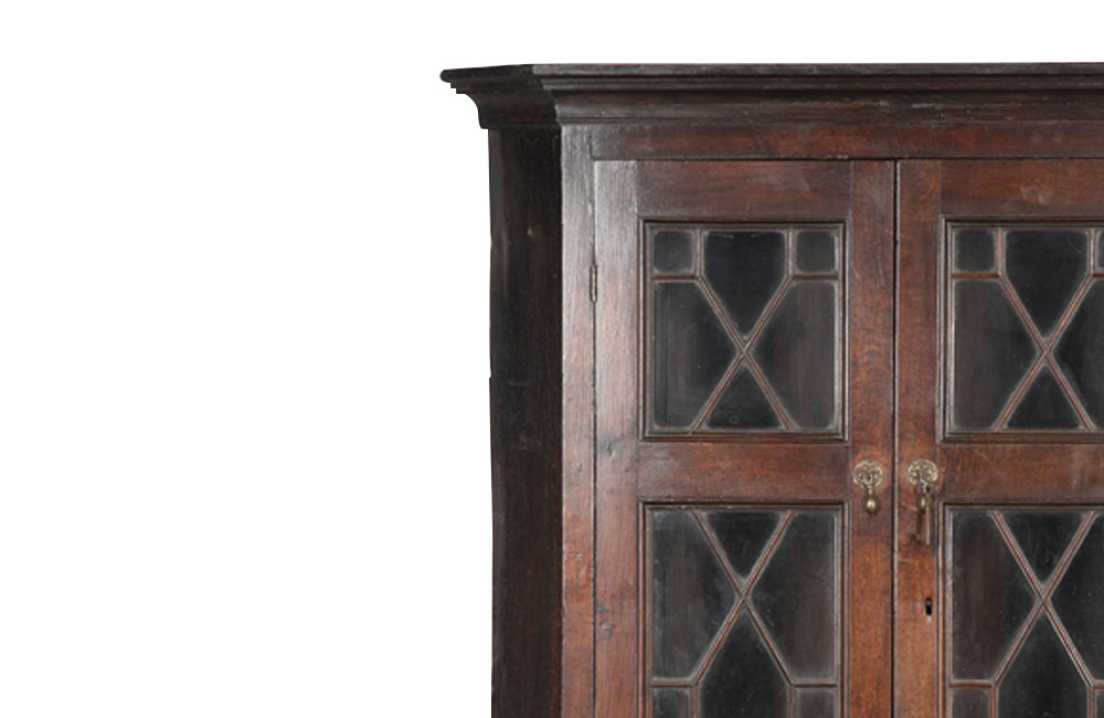 19th century, English, two piece oak corner cupboard with glazed astragal doors to top and bottom 