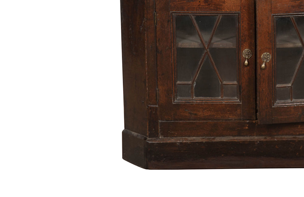 19th century, English, two piece oak corner cupboard with glazed astragal doors to top and bottom 