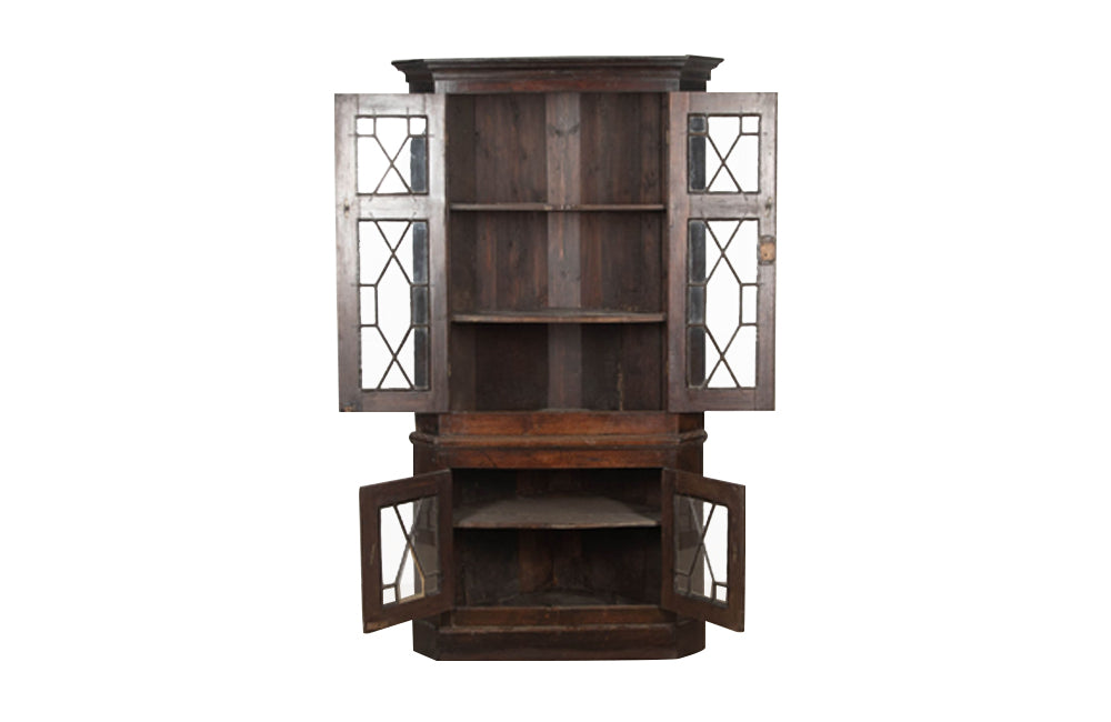19th century, English, two piece oak corner cupboard with glazed astragal doors to top and bottom 