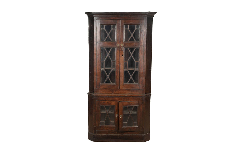 19th century, English, two piece oak corner cupboard with glazed astragal doors to top and bottom 