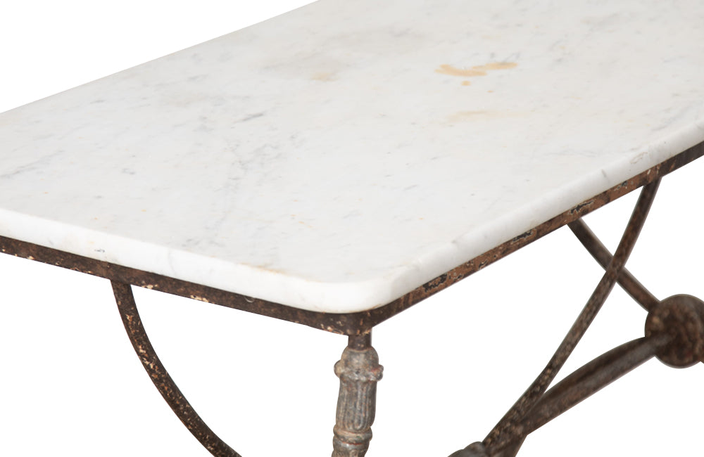 Beautiful 19th century French iron based table with lead medallions and ornamentation to arched stretcher and top of legs.