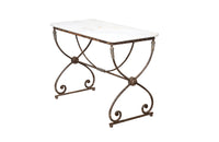Beautiful 19th century French iron based table with lead medallions and ornamentation to arched stretcher and top of legs.