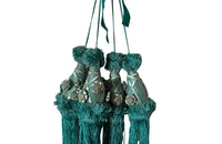 Set of four 19th Century French blue silk passementerie decorated with rosettes.
