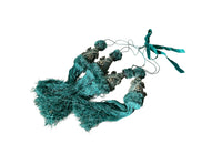 Set of four 19th Century French blue silk passementerie decorated with rosettes.