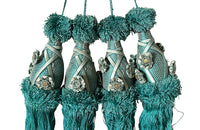 Set of four 19th Century French blue silk passementerie decorated with rosettes.
