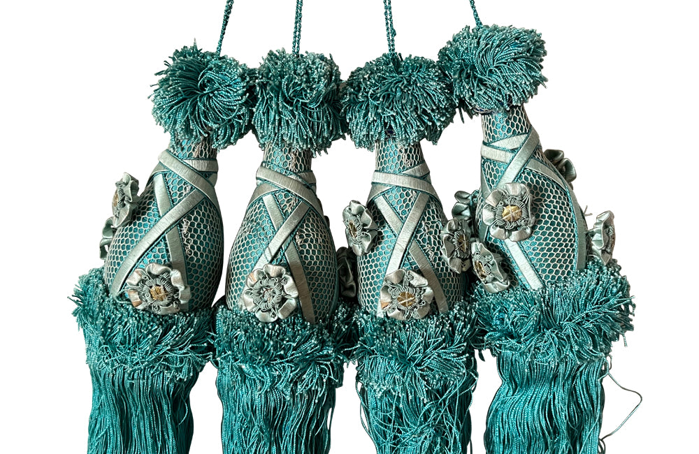 Set of four 19th Century French blue silk passementerie decorated with rosettes.
