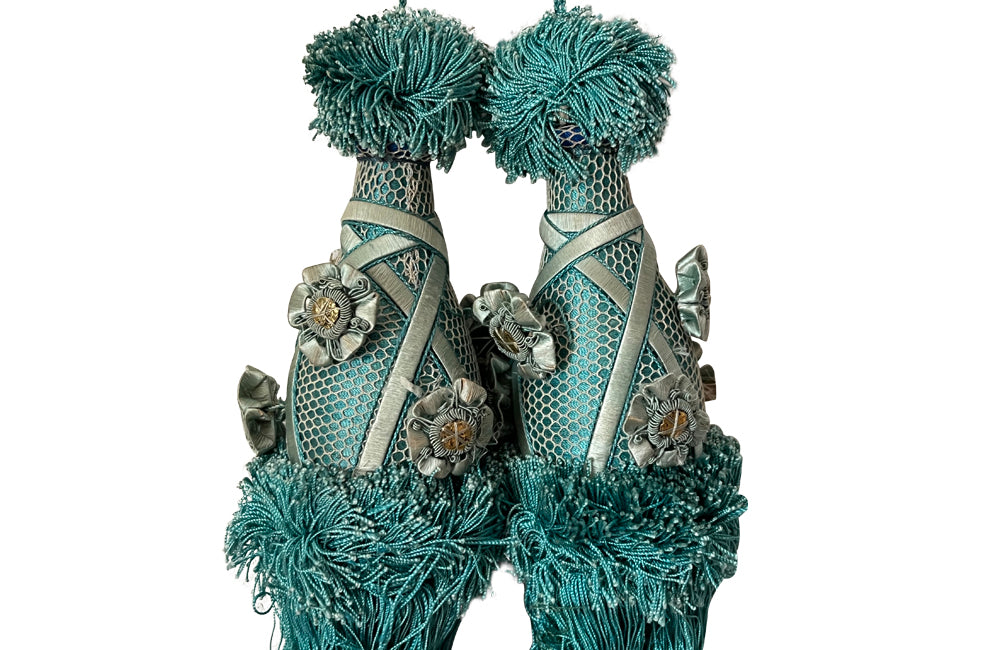 Set of four 19th Century French blue silk passementerie decorated with rosettes.