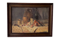 Antique oil painting 19th Century French of wine, a pottery jug a pipe tobacco garlic, radishes, bread and a sausage unwrapped in its paper.