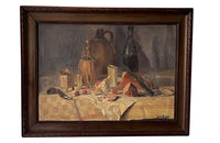 Antique oil painting 19th Century French of wine, a pottery jug a pipe tobacco garlic, radishes, bread and a sausage unwrapped in its paper.