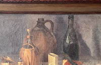 Antique oil painting 19th Century French of wine, a pottery jug a pipe tobacco garlic, radishes, bread and a sausage unwrapped in its paper.