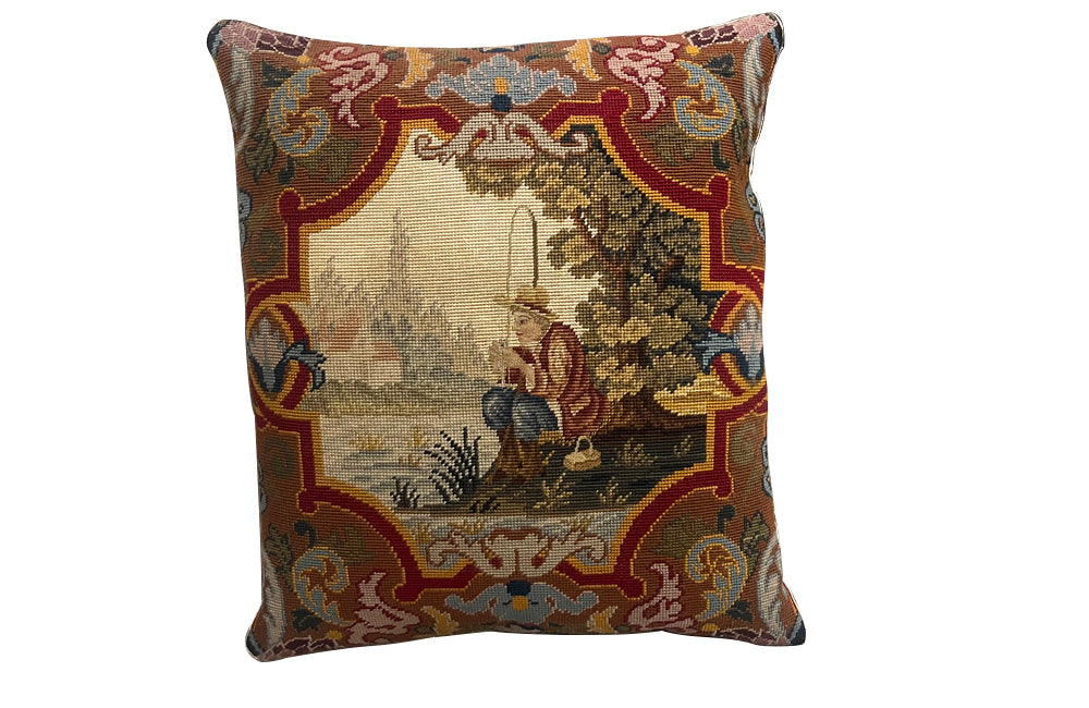 Antique cushion French tapestry cushion Depicting a fisherman in his straw hat, he sits on the banks of a river admiring his catch. To his side is a lidded basket. 19th century. French antiques.