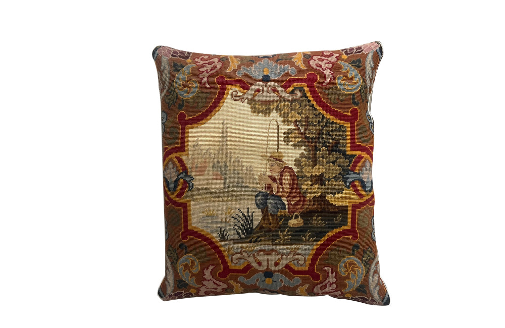 Antique cushion French tapestry cushion Depicting a fisherman in his straw hat, he sits on the banks of a river admiring his catch. To his side is a lidded basket. 19th century. French antiques.