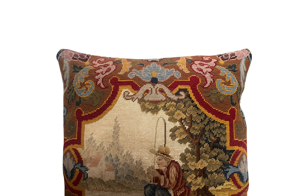 Antique cushion French tapestry cushion Depicting a fisherman in his straw hat, he sits on the banks of a river admiring his catch. To his side is a lidded basket. 19th century. French antiques.