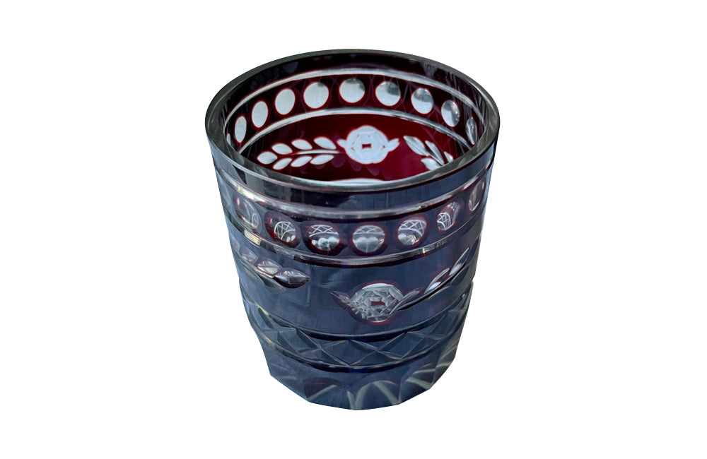 Set of eleven cut deep red glass whisky glasses.