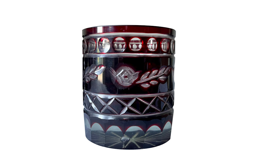 Set of eleven cut deep red glass whisky glasses.