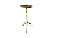 Spanish, gilt iron martini table with decorative coiled rim top, twisted stem and shaped tripod base with arrow point feet.