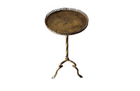 Spanish, gilt iron martini table with decorative coiled rim top, twisted stem and shaped tripod base with arrow point feet.