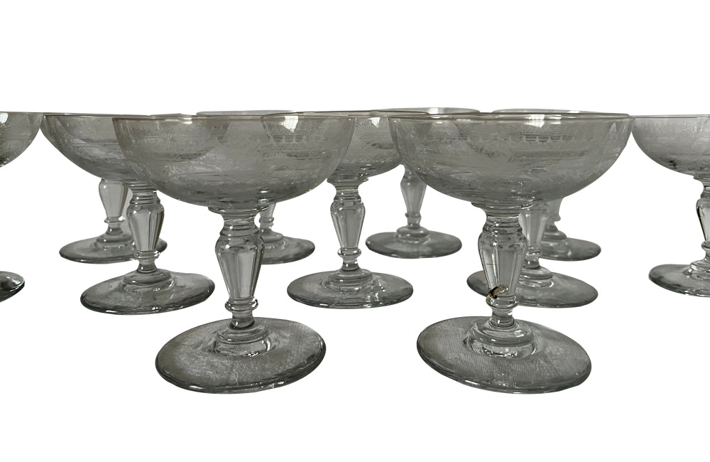 Beautiful set of 11 French champagne coupes decorated with a neo-classical etched design featuring galands of flowers.  c.1900