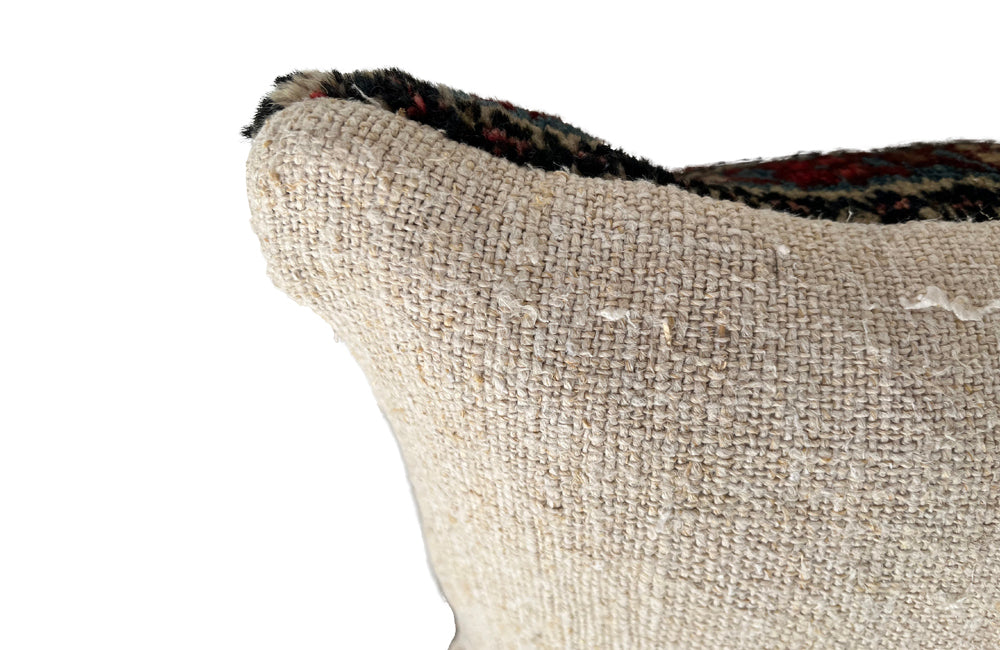 Feather filled, cushion made with early 20th Century carpet and antique hemp.