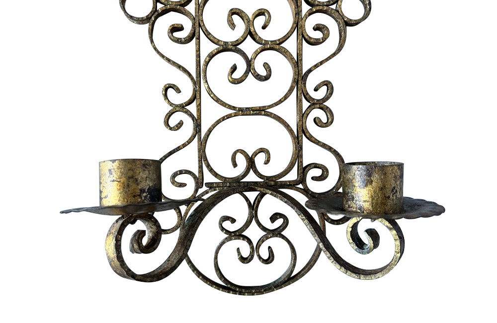Pair of mid 20th Century Spanish gilt scroll work iron wall sconces.