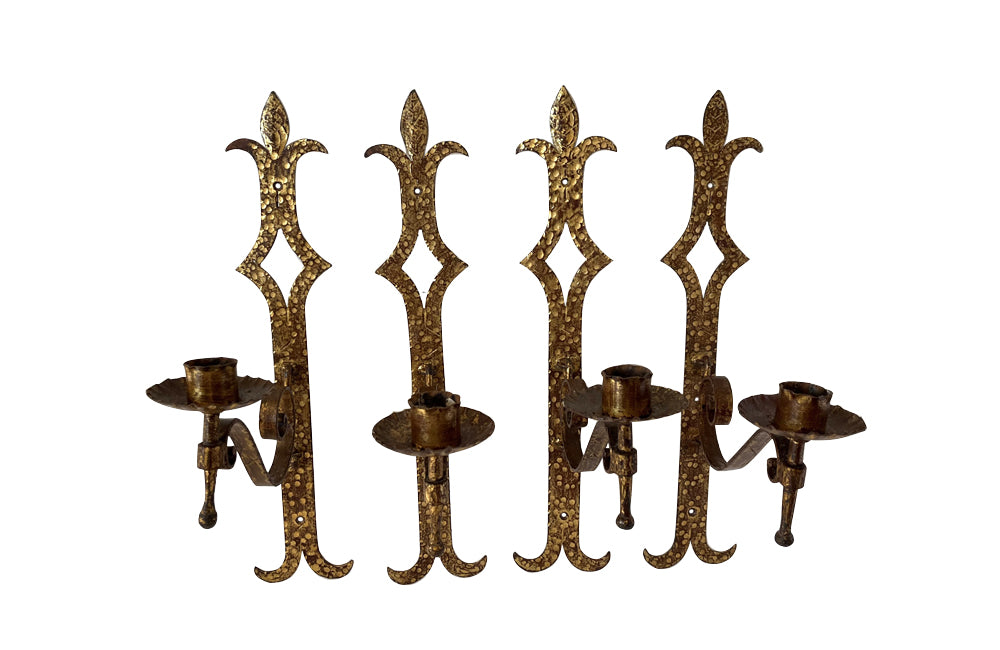 Set of 20th century Spanish decorative four gilt iron wall appliques.