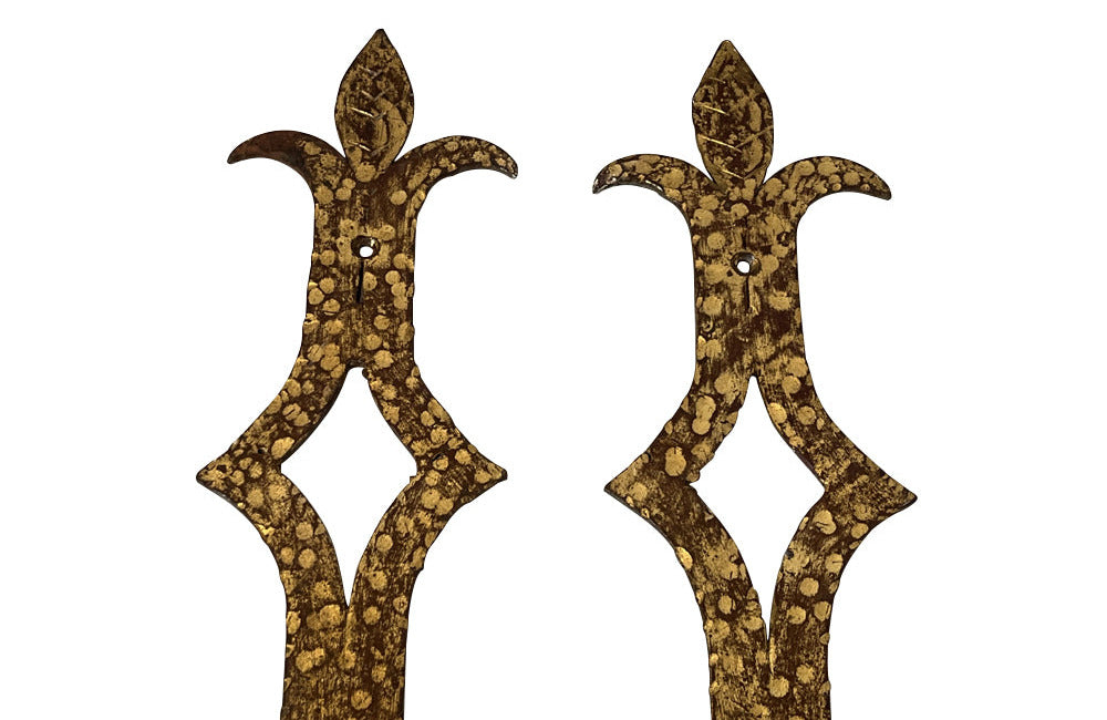 Set of 20th century Spanish decorative four gilt iron wall appliques.