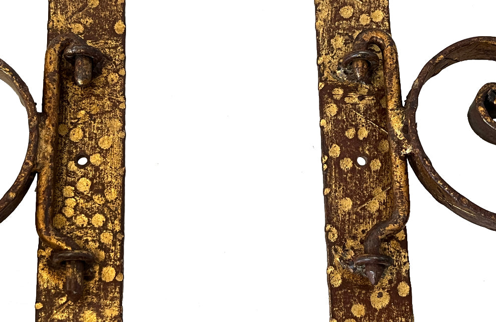 Set of 20th century Spanish decorative four gilt iron wall appliques.