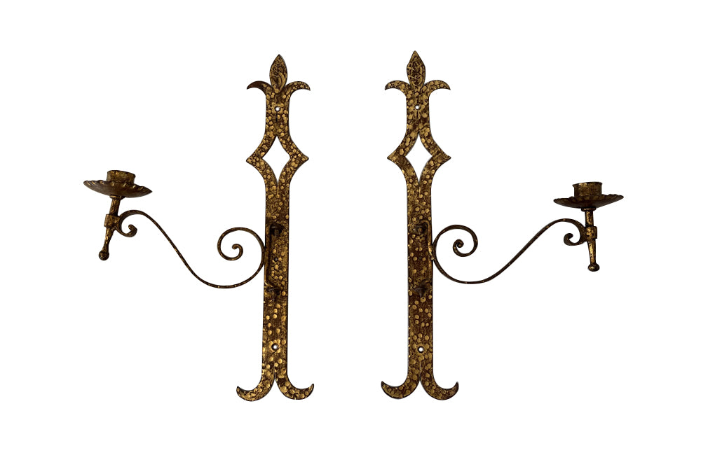 Set of 20th century Spanish decorative four gilt iron wall appliques. 