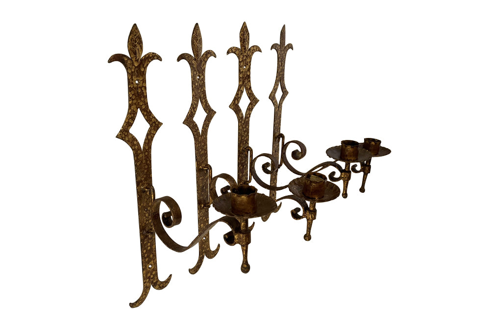 Set of 20th century Spanish decorative four gilt iron wall appliques.