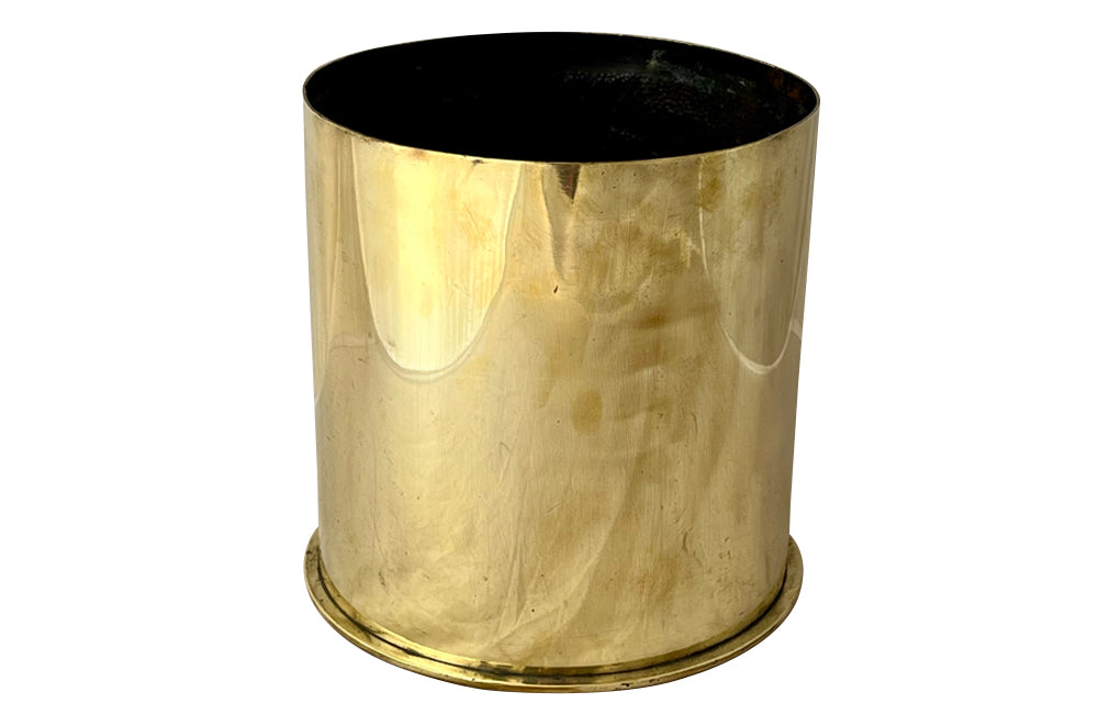 Antique brass shell casing dating to the First World War and fashioned into a wine cooler or cache pot.