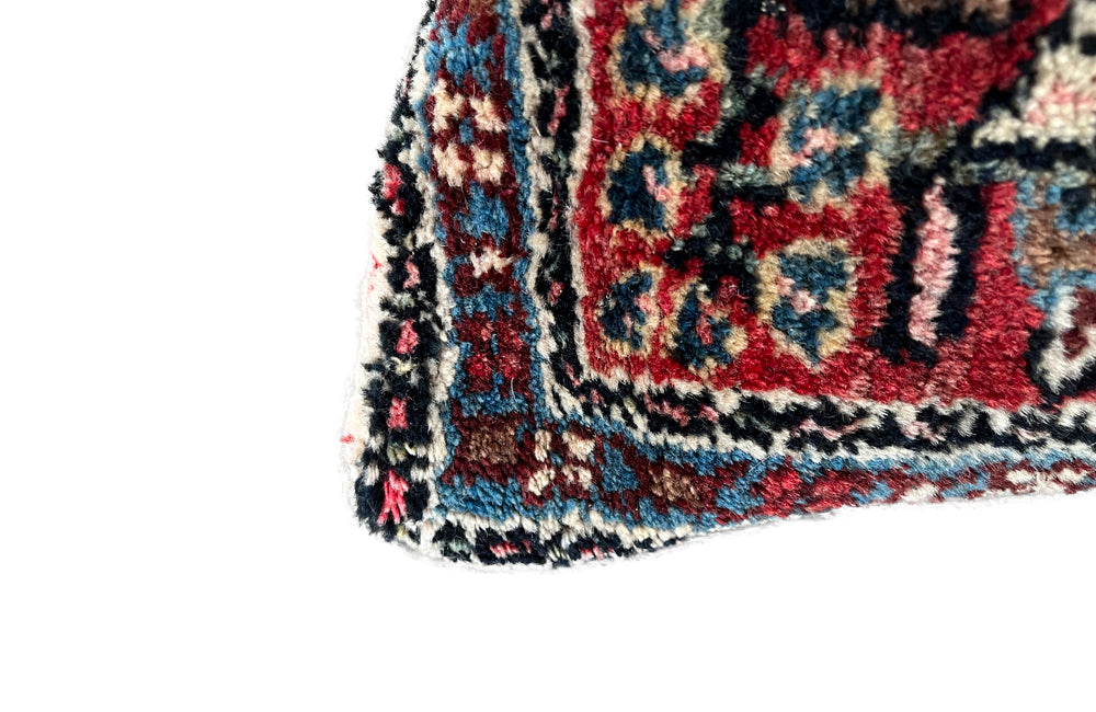 Feather filled, cushion made with early 20th Century carpet and antique hemp.