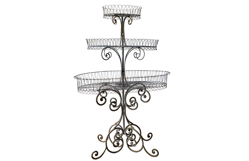 Large French iron wirework florists plant stand with three tiers.