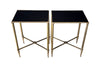 Pair of 20th century elegant brass end tables in the Maison Jansen style with black glass tops