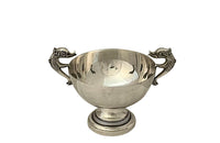 Decorative silver plate bowl with dolphin handles on raised foot and stamped with makers mark B.R.