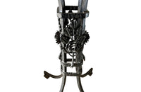 Tall black iron Art Deco plant stand in the manner of Edgar Brandt. Rose ornamentation to all sides of support. Circa 1930