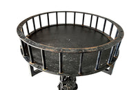 Tall black iron Art Deco plant stand in the manner of Edgar Brandt. Rose ornamentation to all sides of support. Circa 1930