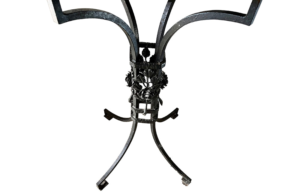 Tall black iron Art Deco plant stand in the manner of Edgar Brandt. Rose ornamentation to all sides of support. Circa 1930