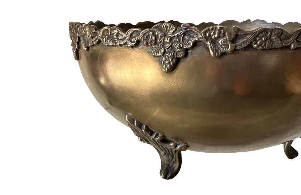 Large round champagne bucket with pretty grape vine decoration to the rim. It sits on four raised ornate feet - French Antiques