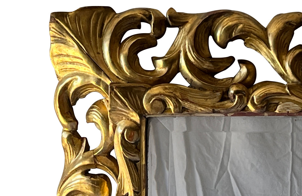 Beautiful 19th century openwork carved giltwood framed mirror in the Louis XIV style.