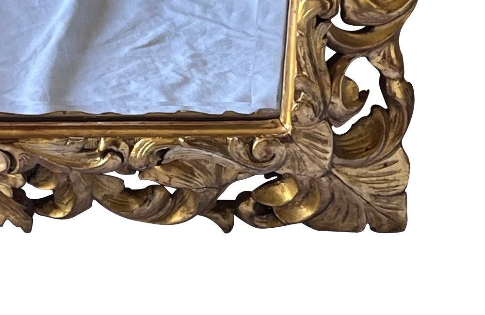 Beautiful 19th century openwork carved giltwood framed mirror in the Louis XIV style.
