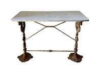 19th Century French bistro table with winged dragon supports and marble top. Great patination