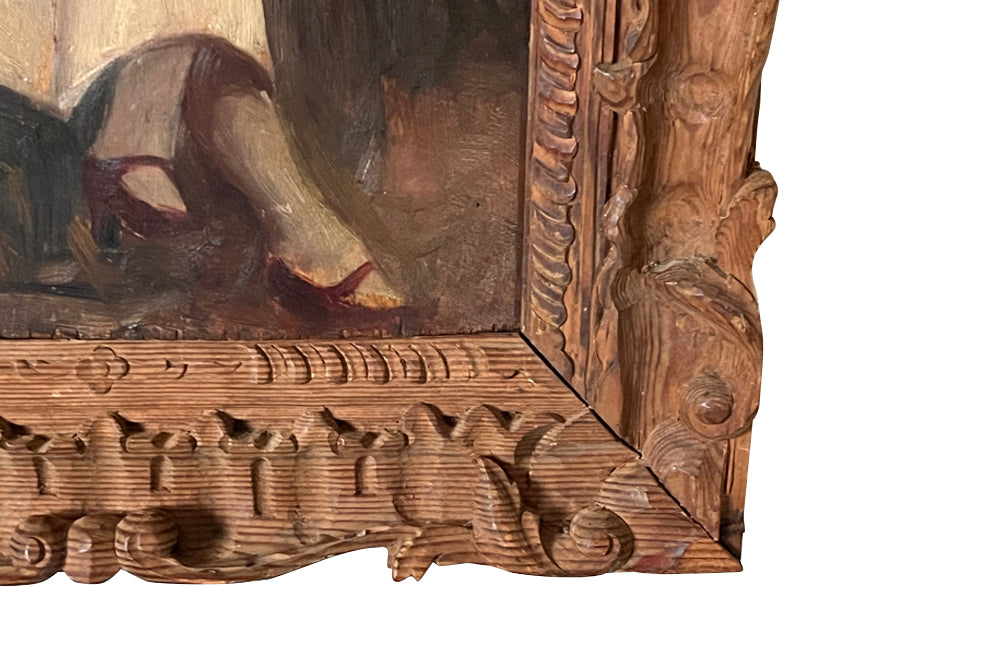 Charming framed oil on wood painting of a seated young woman reading in her garden .