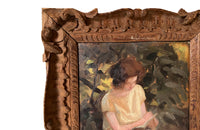 Charming framed oil on wood painting of a seated young woman reading in her garden .