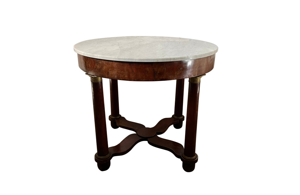 mahogany Empire centre table with Carrara marble top and stylised cross-stretcher.