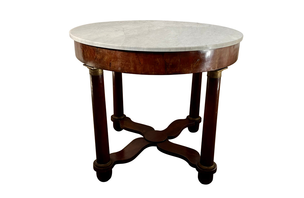 mahogany Empire centre table with Carrara marble top and stylised cross-stretcher.