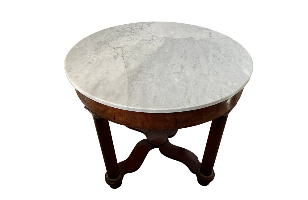 mahogany Empire centre table with Carrara marble top and stylised cross-stretcher.