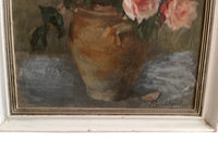 Signed 20th Century French framed still life oil on wood painting of roses in a confit pot.