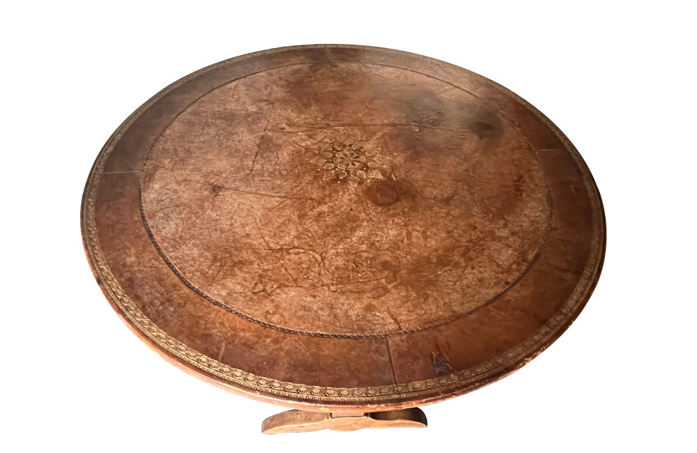 French,19th century, vineyard table with nicely worn embossed leather top .